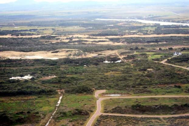 Earthen canal constructed to detour heavy falls from the west -4