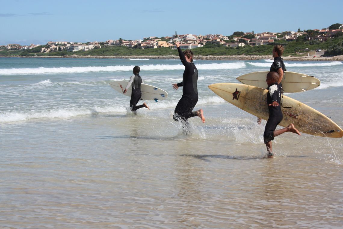 Racing into the surf for surf lessons