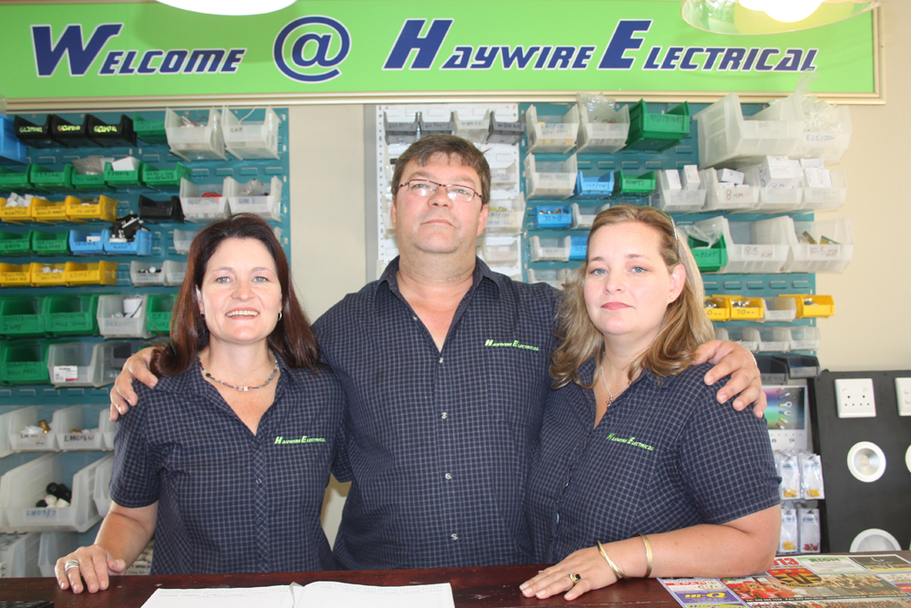 Gerrie Botha and his wife Jacqueline, right stand prouldy inside their newHaywire electrical premises in St Francis Drive, St Francis Bay. With them, left, is Yvette Maritz, sister to Jacqueline. .