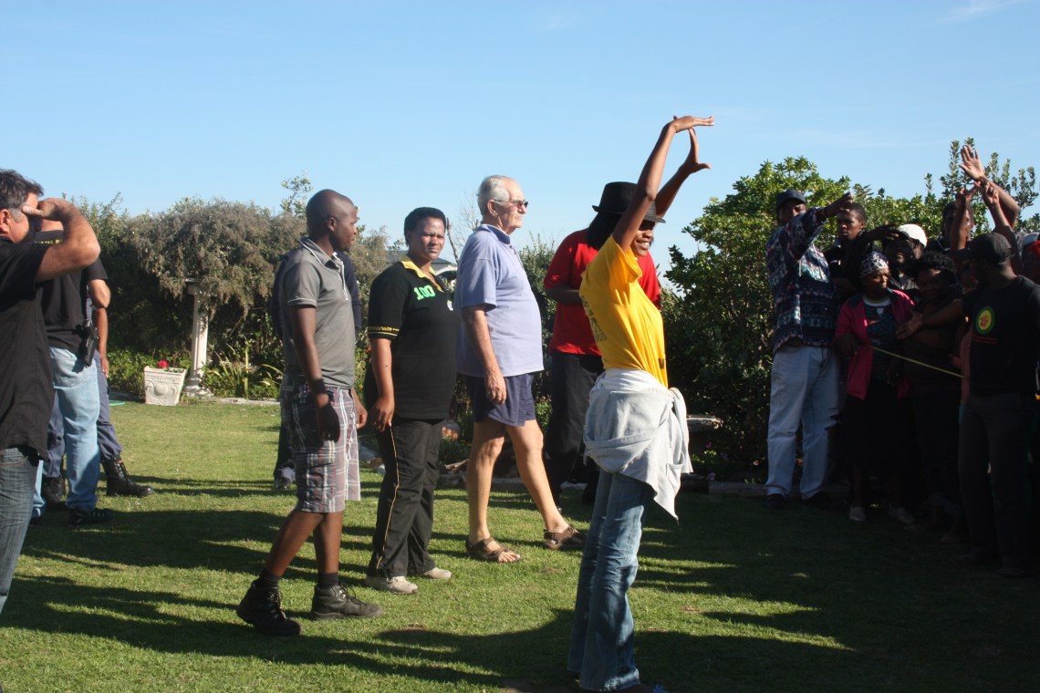 Clr ben Rheeder in blue shirt comes out of his house to address the marchers this morning. photo: Bev Mortimer, St Francis Chronicle