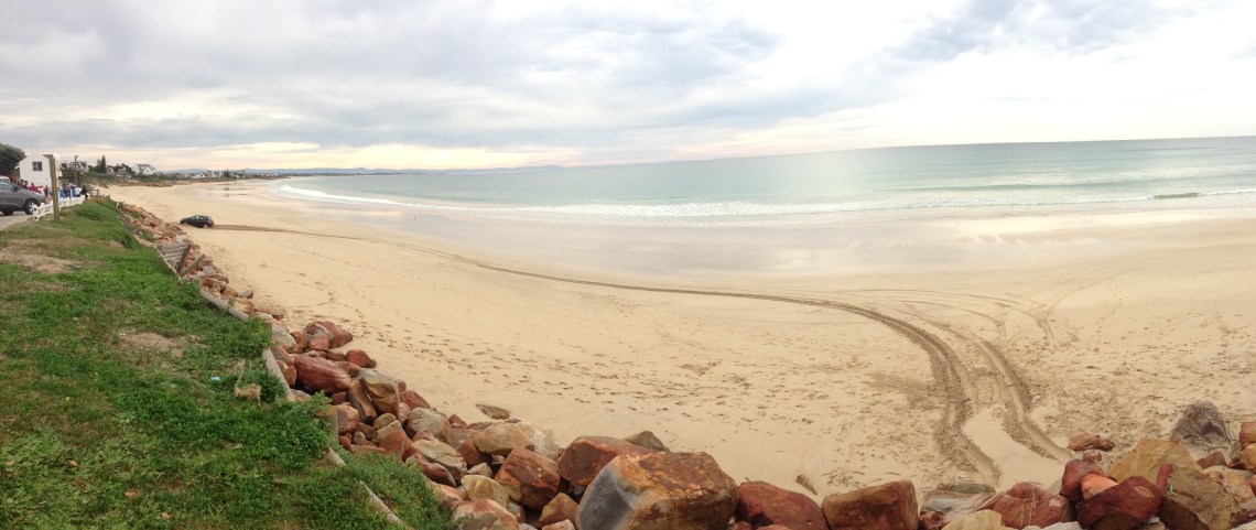 photo of car ont he beach