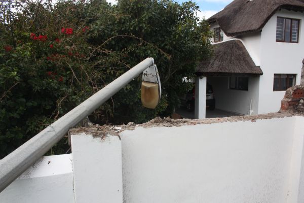 Wall damaaged after car ploughs into street pole 006