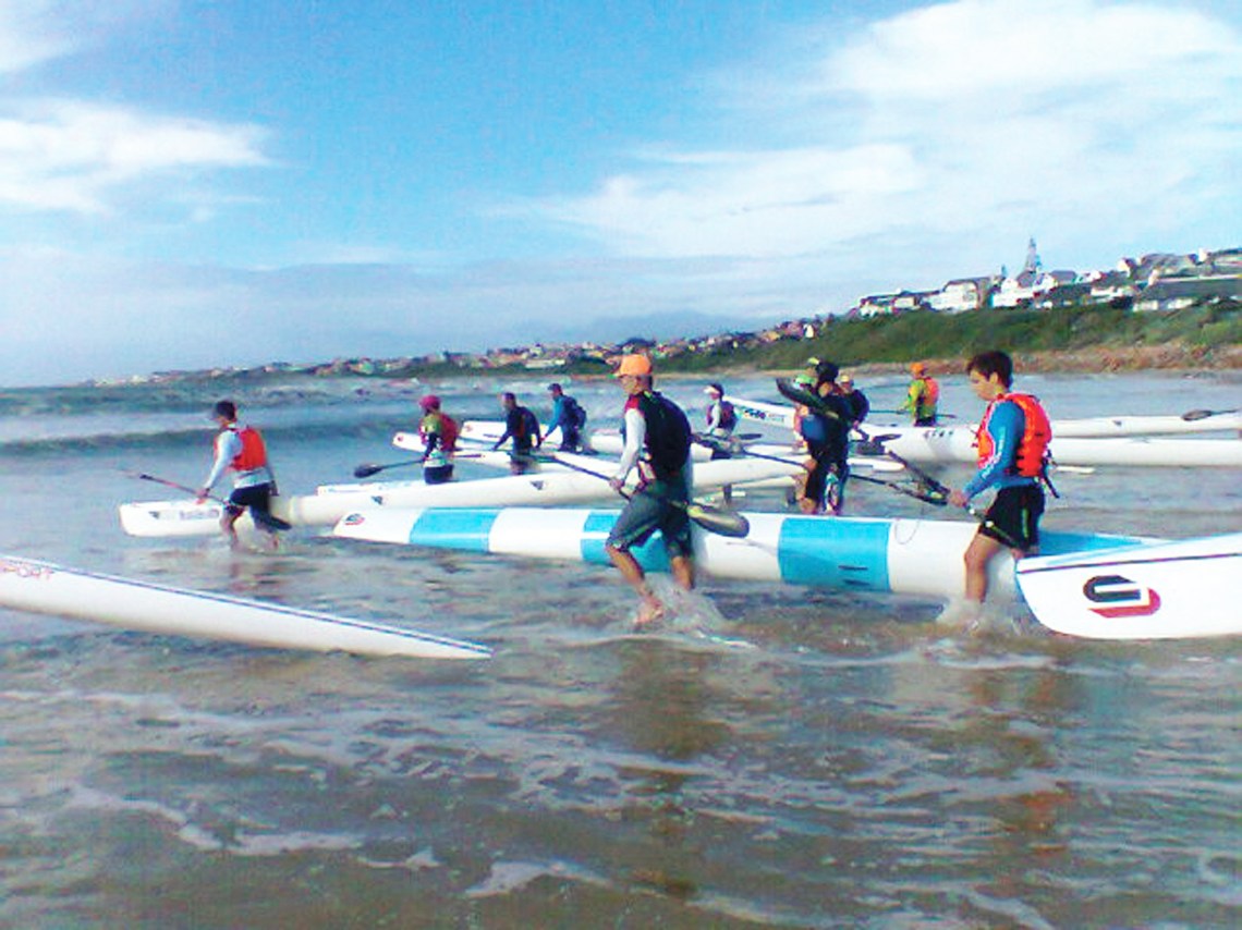 Paddlers entering the sea at Main beach, St Francis Bay. Photo: Donna
