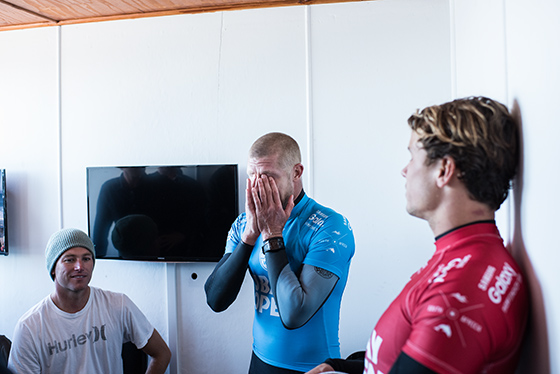 Mick Fanning of Australia (pictured) holds his head in his hands taking the gravity of the situation after being attacked by a shark during the JBay Open on Sunday July 19, 2015.